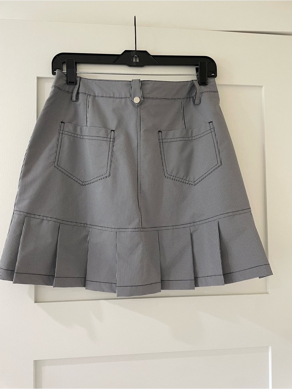 IBKUL Women’s Pleated Mini Skirt in Black and White